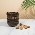 Family set of four polished coconut bowls with wooden spoons